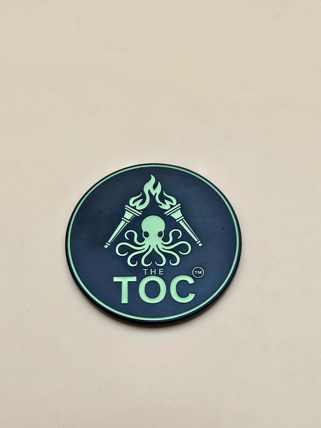 The TOC Founding Challenge Coin – Numbered Glow-in-the-Dark Edition