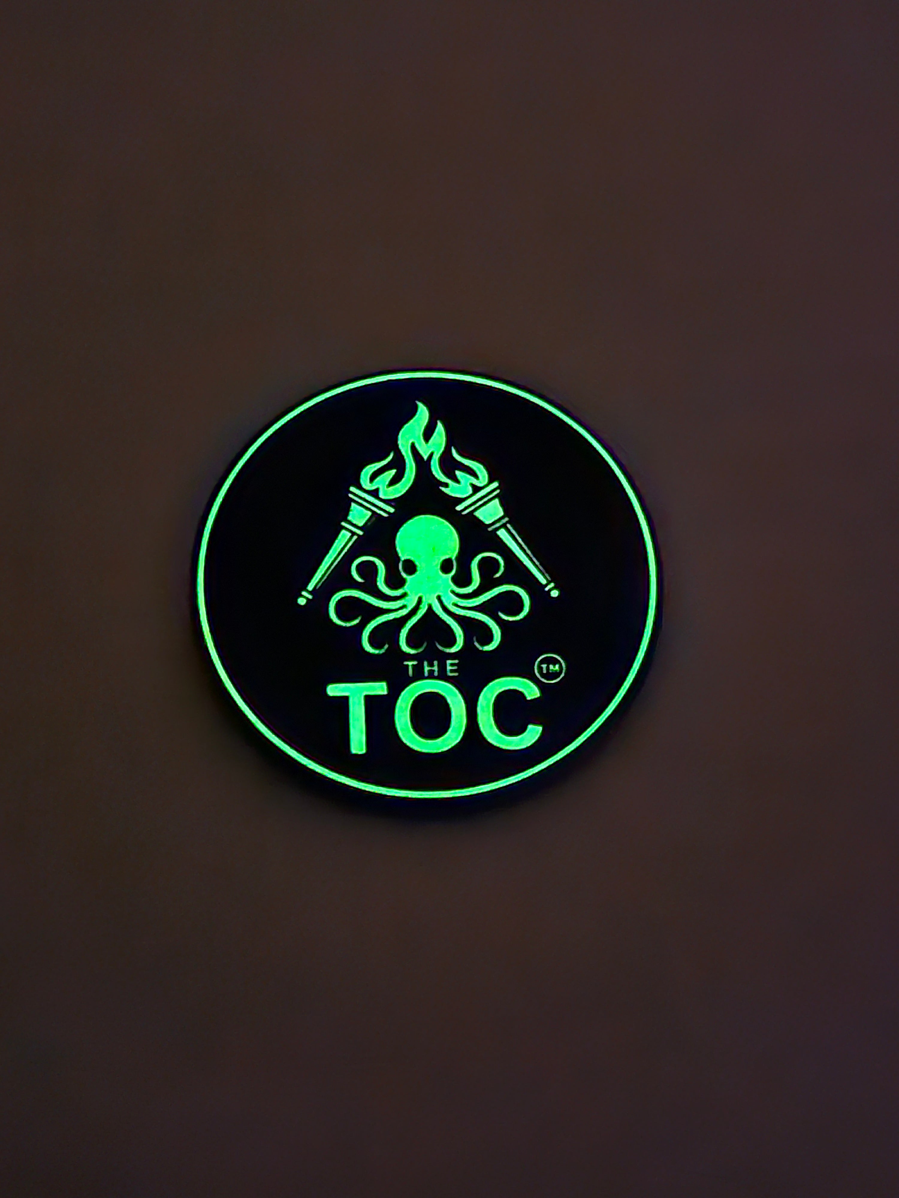 The TOC Founding Challenge Coin – Numbered Glow-in-the-Dark Edition