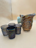 Vintage Imperial Glass carnival glass water pitcher and matching tumblers in the Grape pattern