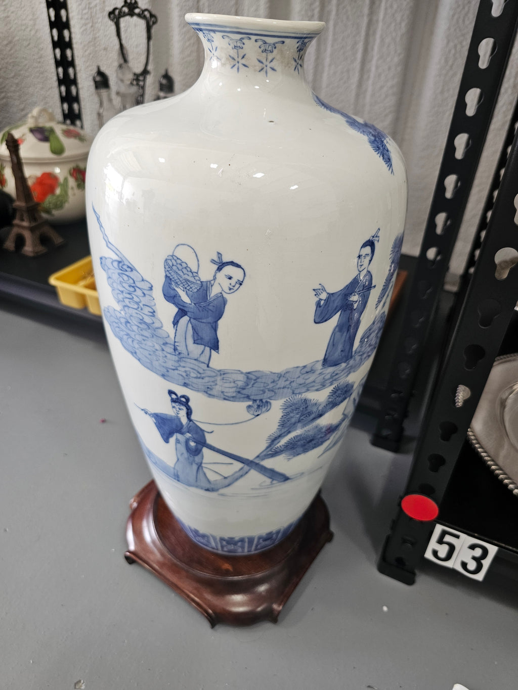 Chinese blue and white porcelain vase featuring hand-painted figural landscape motifs,