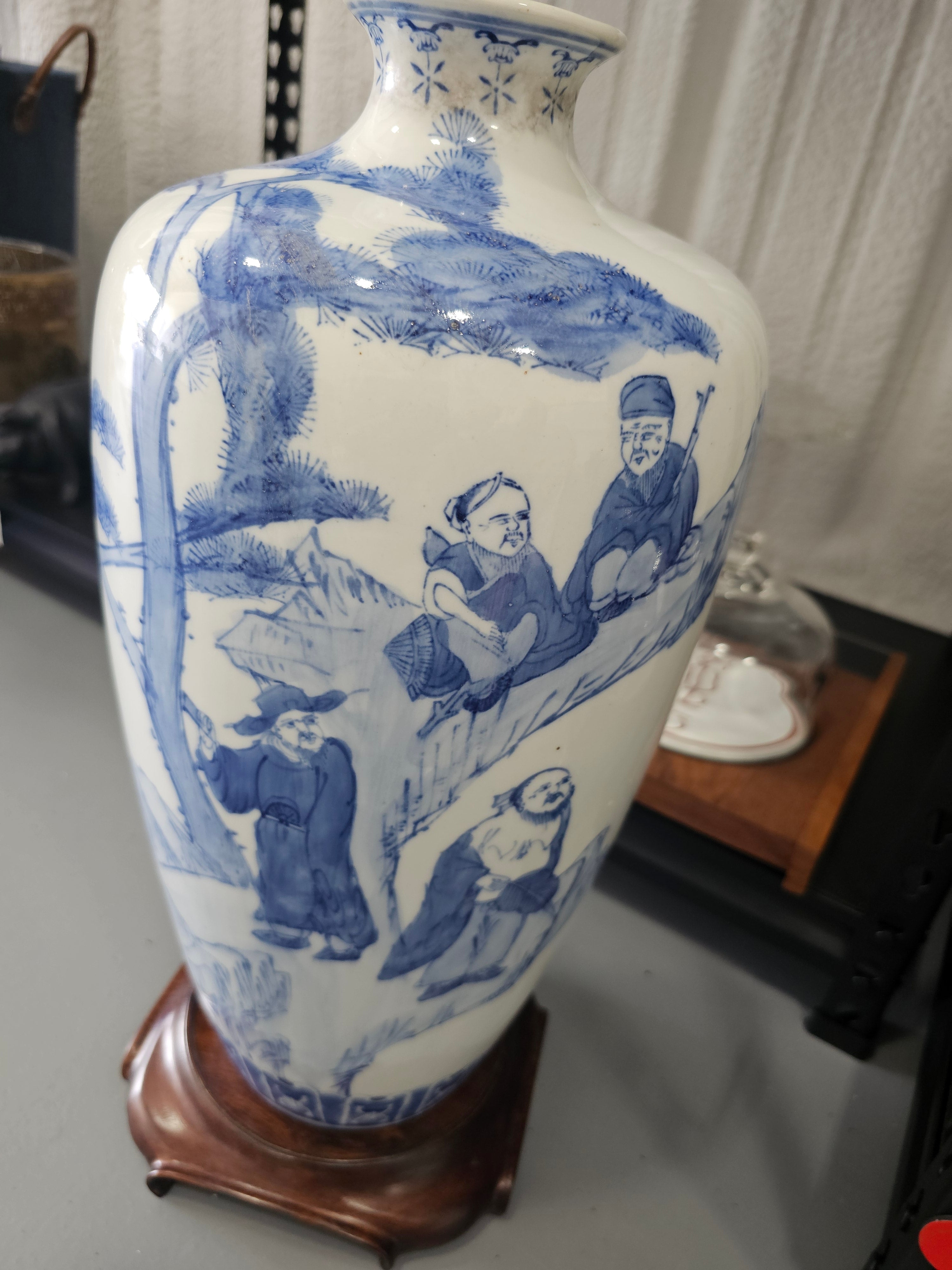 Chinese blue and white porcelain vase featuring hand-painted figural landscape motifs,