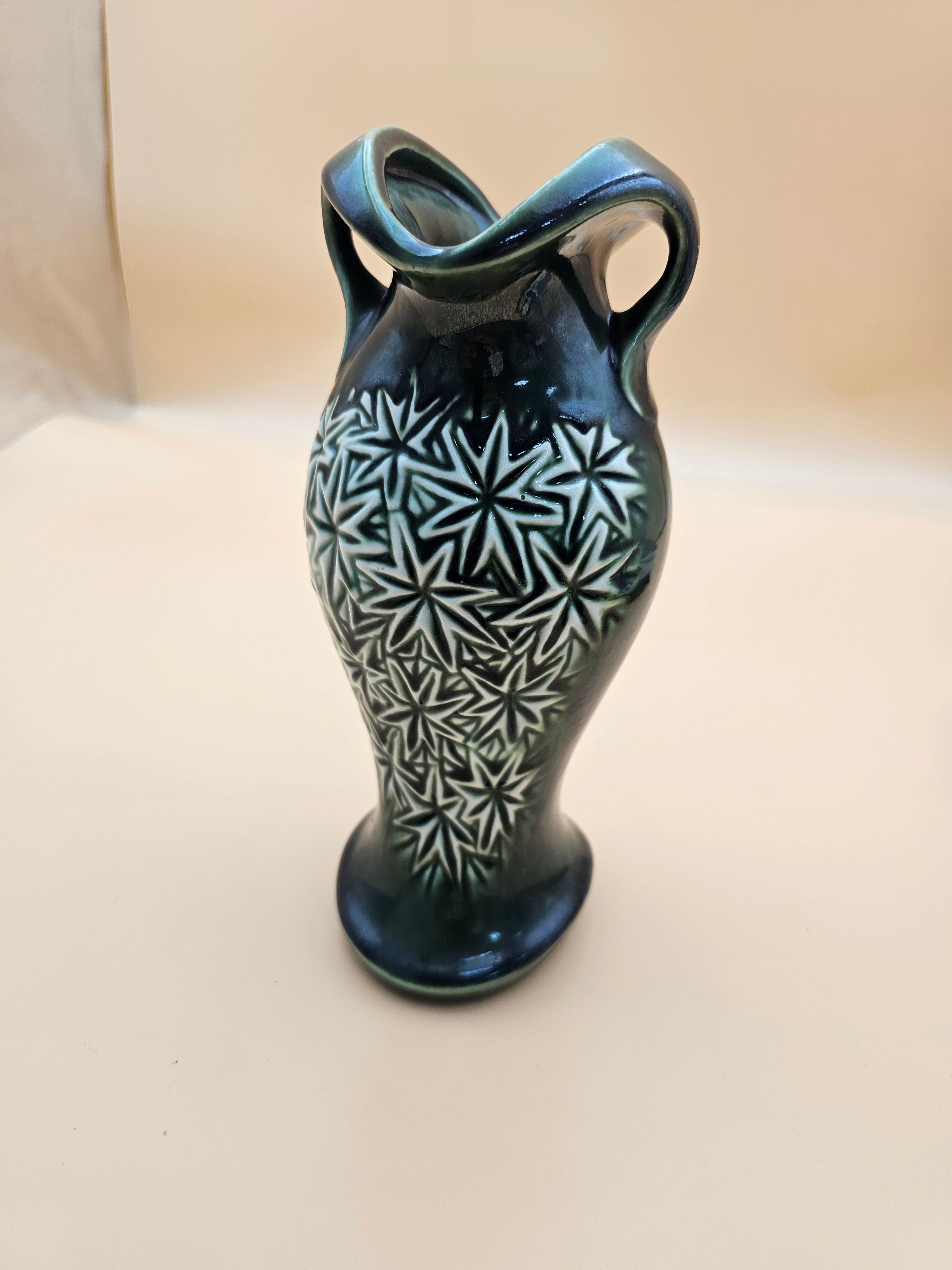 Vintage dark green starburst ceramic two-handled vase produced in 1968 by Mount Clemens Pottery/McCoy.